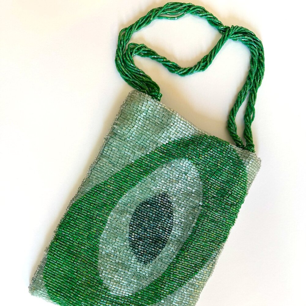Mandala two tone green beaded bag with swirl design one front.
